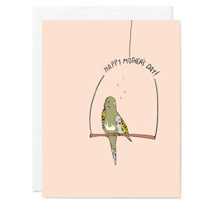 Illustrated pink mother's day greeting card with drawing of green parakeet mom and her baby, hand lettered words read 'Happy Mother's Day'